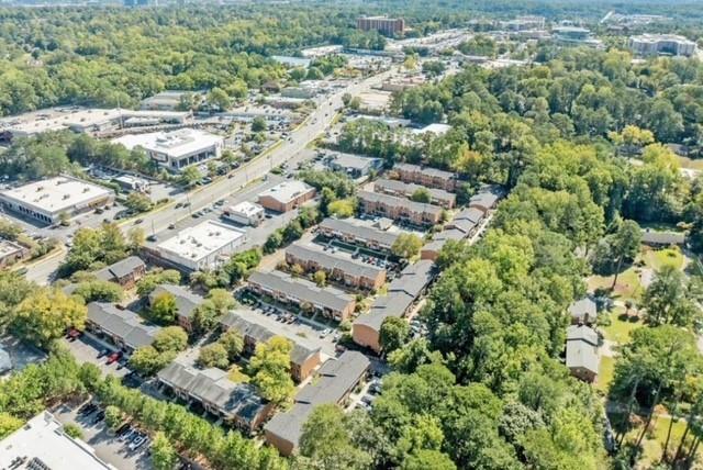 6520 Roswell Road, Unit 62 Atlanta, GA 30328 - Photo 31 of 34 an aerial view of residential houses with outdoor space and trees