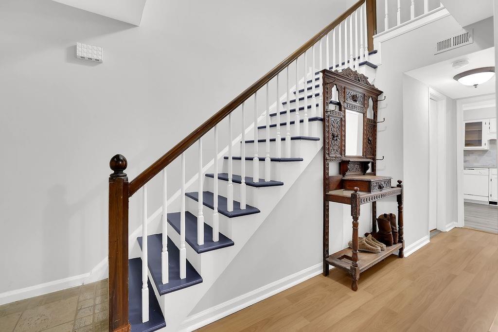 6520 Roswell Road, Unit 62 Atlanta, GA 30328 - Photo 6 of 34 a view of entryway with wooden floor and stairs