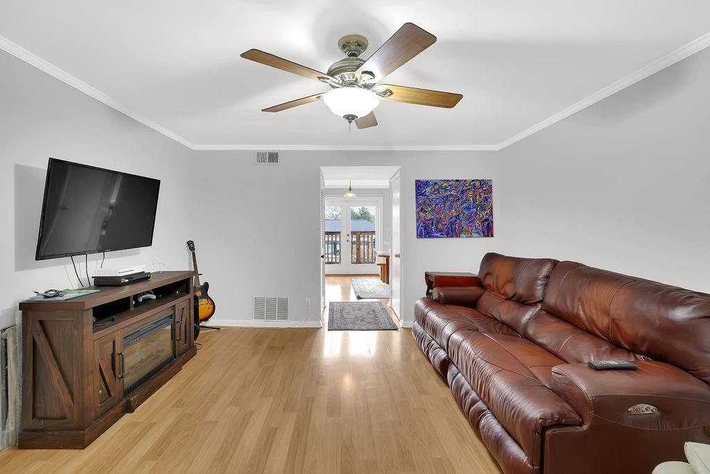 6520 Roswell Road, Unit 62 Atlanta, GA 30328 - Photo 8 of 34 a living room with furniture and a flat screen tv