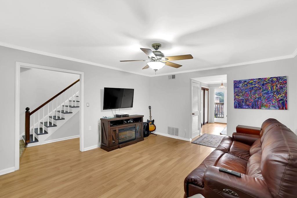 6520 Roswell Road, Unit 62 Atlanta, GA 30328 - Photo 9 of 34 a living room with furniture and a flat screen tv