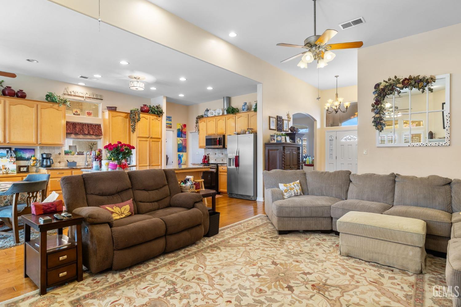 Undisclosed Address Bakersfield, CA 93313 - Photo 11 of 49 a living room with furniture and a view of kitchen