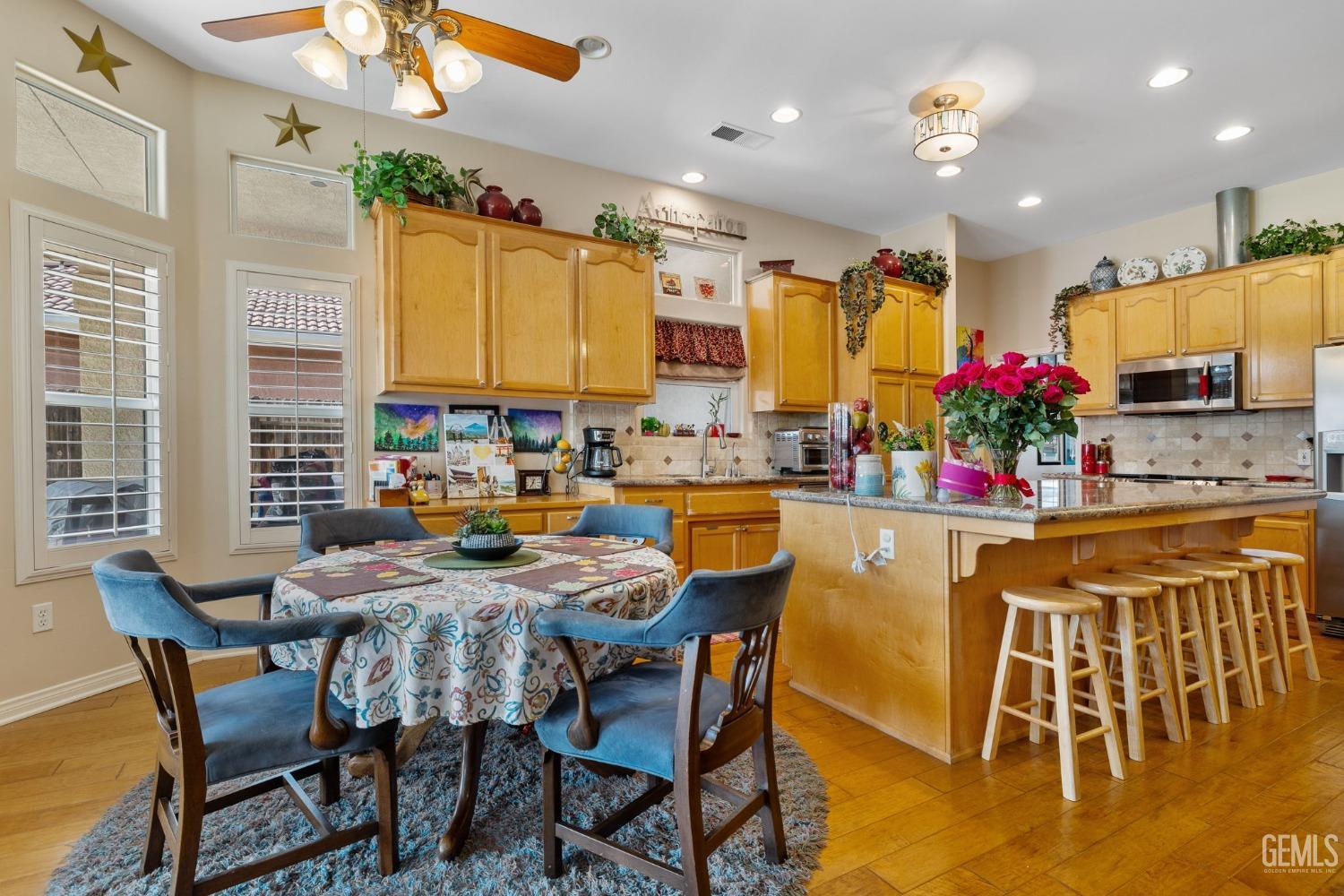 Undisclosed Address Bakersfield, CA 93313 - Photo 14 of 49 a view of a dining room with furniture and a chandelier