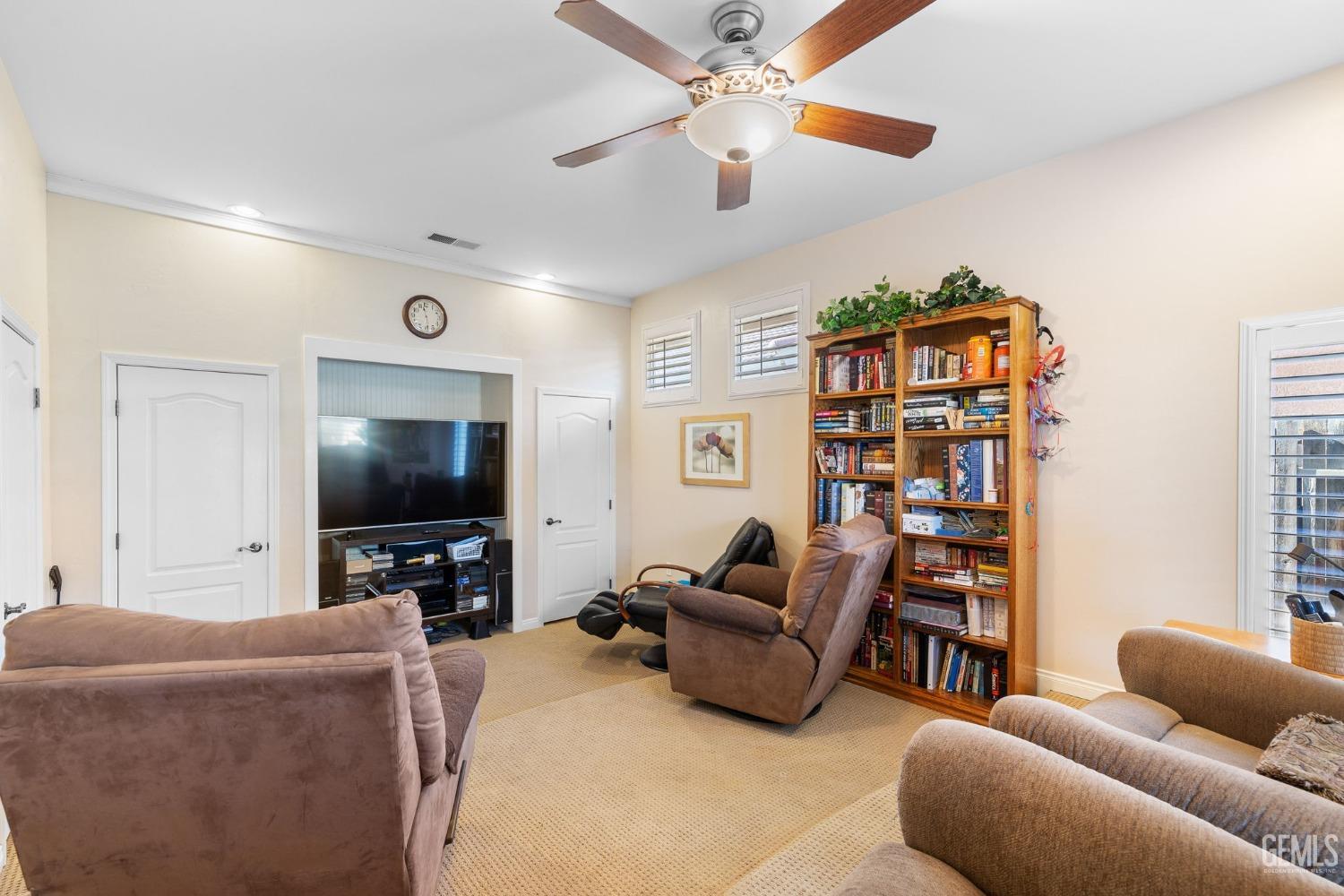 Undisclosed Address Bakersfield, CA 93313 - Photo 21 of 49 a living room with furniture and a flat screen tv