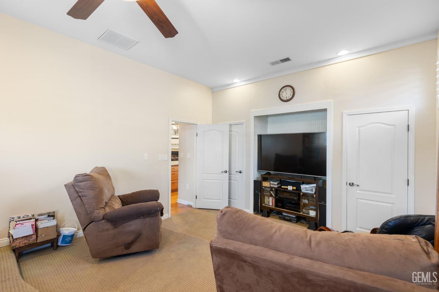 Undisclosed Address Bakersfield, CA 93313 - Photo 22 of 49 a living room with furniture and a flat screen tv