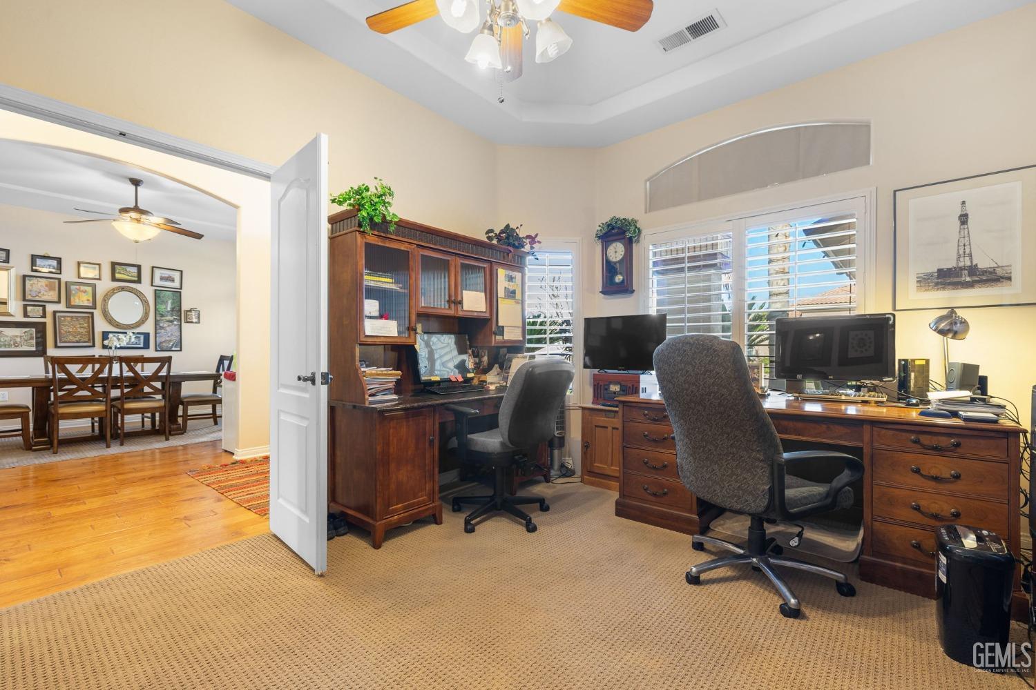 Undisclosed Address Bakersfield, CA 93313 - Photo 25 of 49 a view of a workspace with furniture and a window