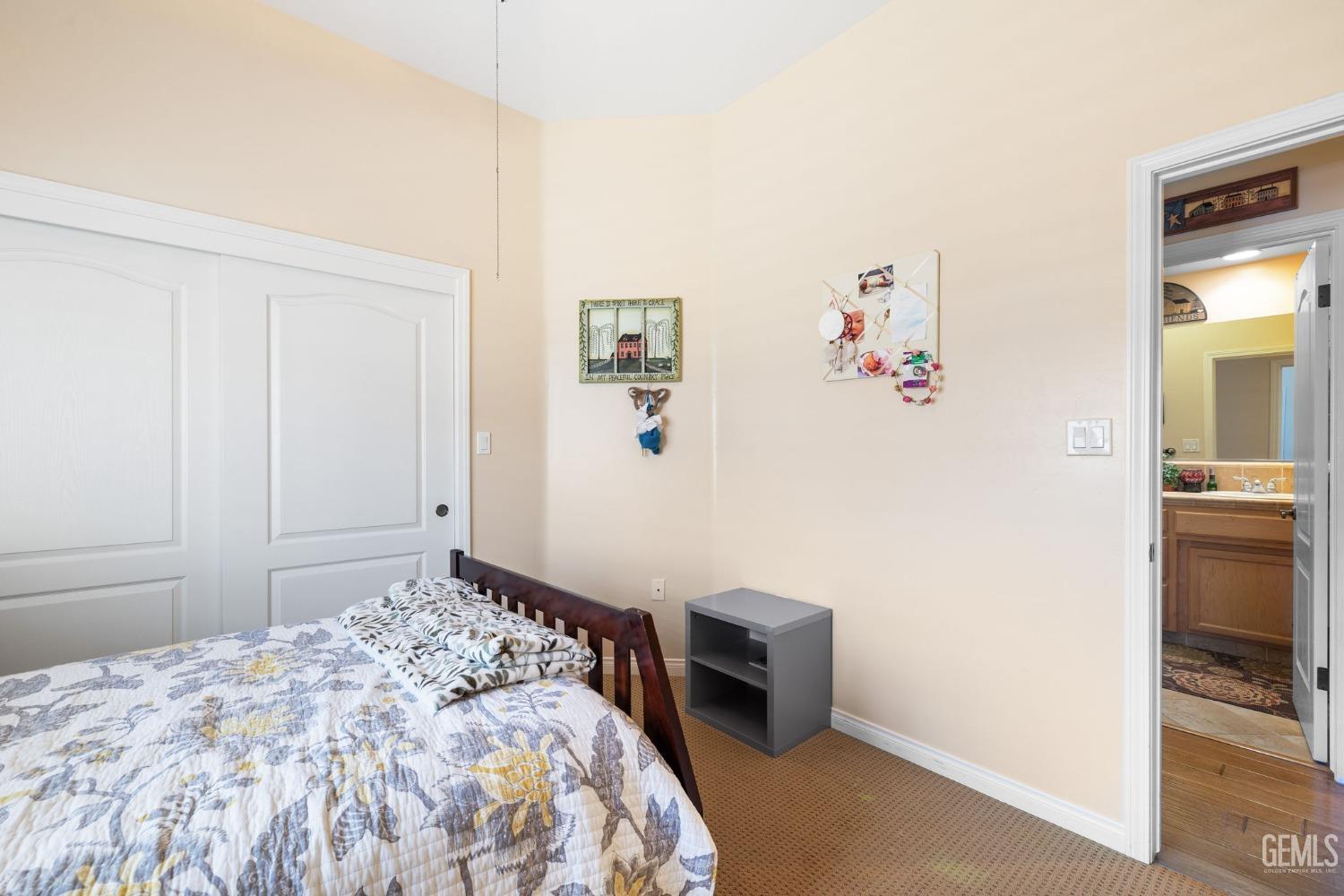 Undisclosed Address Bakersfield, CA 93313 - Photo 34 of 49 a bedroom with a bed and a view of kitchen