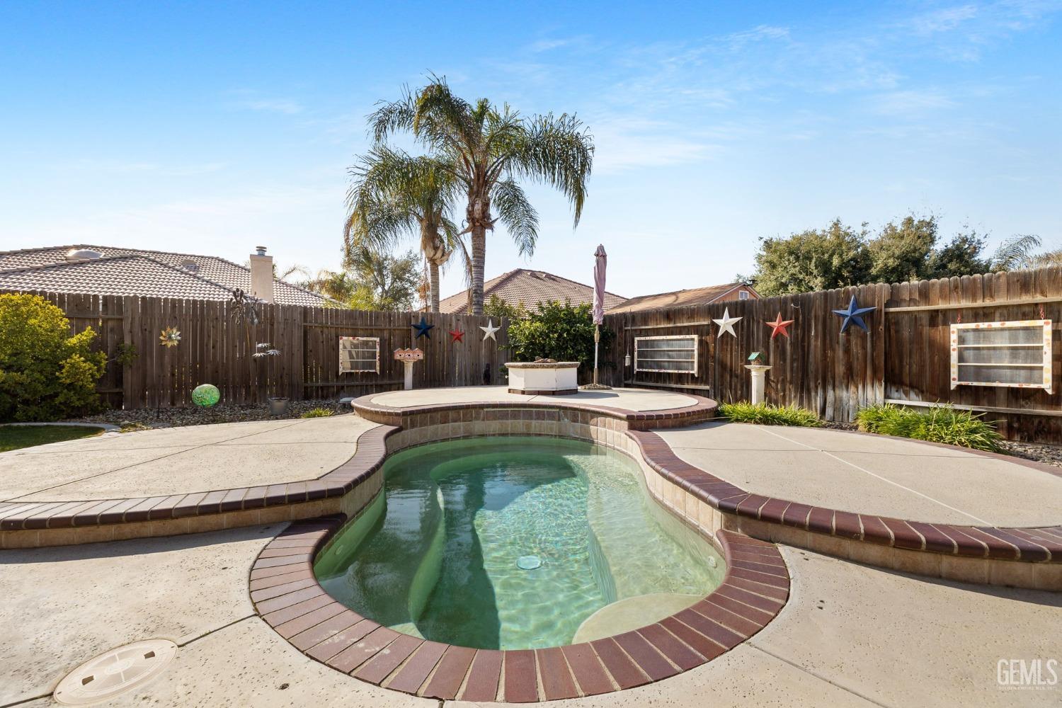 Undisclosed Address Bakersfield, CA 93313 - Photo 40 of 49 a view of a swimming pool with a patio