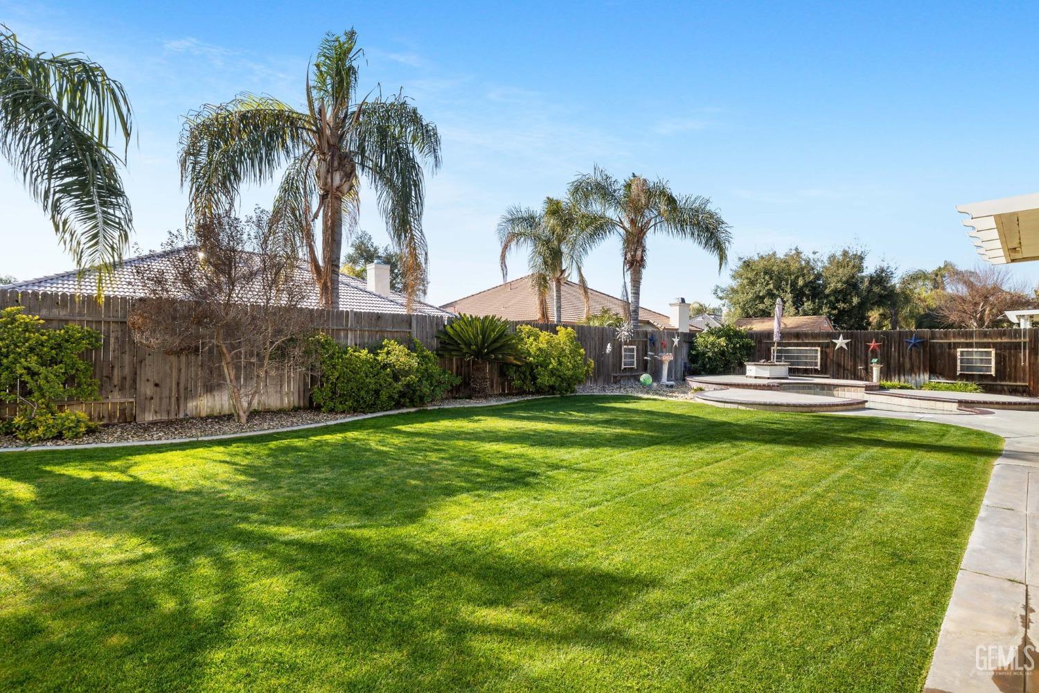 Undisclosed Address Bakersfield, CA 93313 - Photo 42 of 49 a swimming pool with outdoor seating and yard