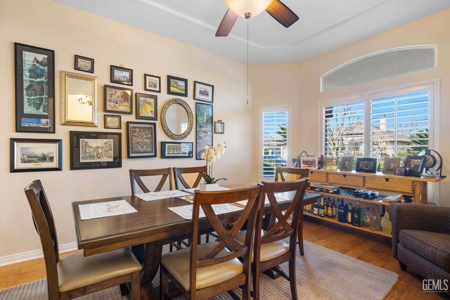 Undisclosed Address Bakersfield, CA 93313 - Photo 5 of 49 a dining room with furniture and wooden floor