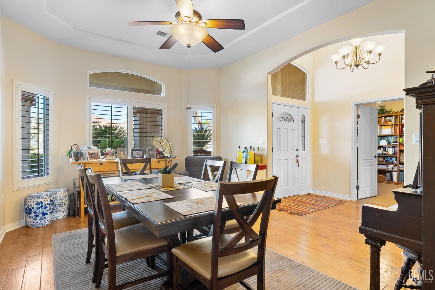 Undisclosed Address Bakersfield, CA 93313 - Photo 6 of 49 a view of a dining room with furniture window and wooden floor