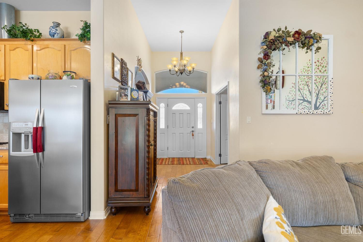 Undisclosed Address Bakersfield, CA 93313 - Photo 7 of 49 a bedroom with a bed and a chandelier