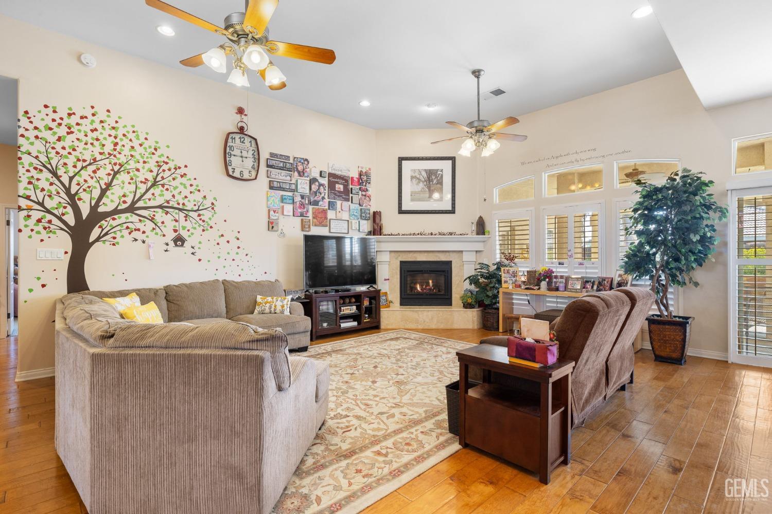 Undisclosed Address Bakersfield, CA 93313 - Photo 8 of 49 a living room with furniture a fireplace and a flat screen tv