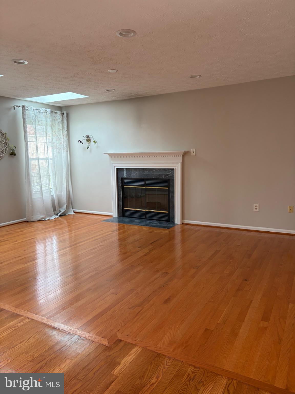 2117 Cross Trails Road Baltimore, MD 21244 - Photo 12 of 30 Spacious room with warm wood floors.