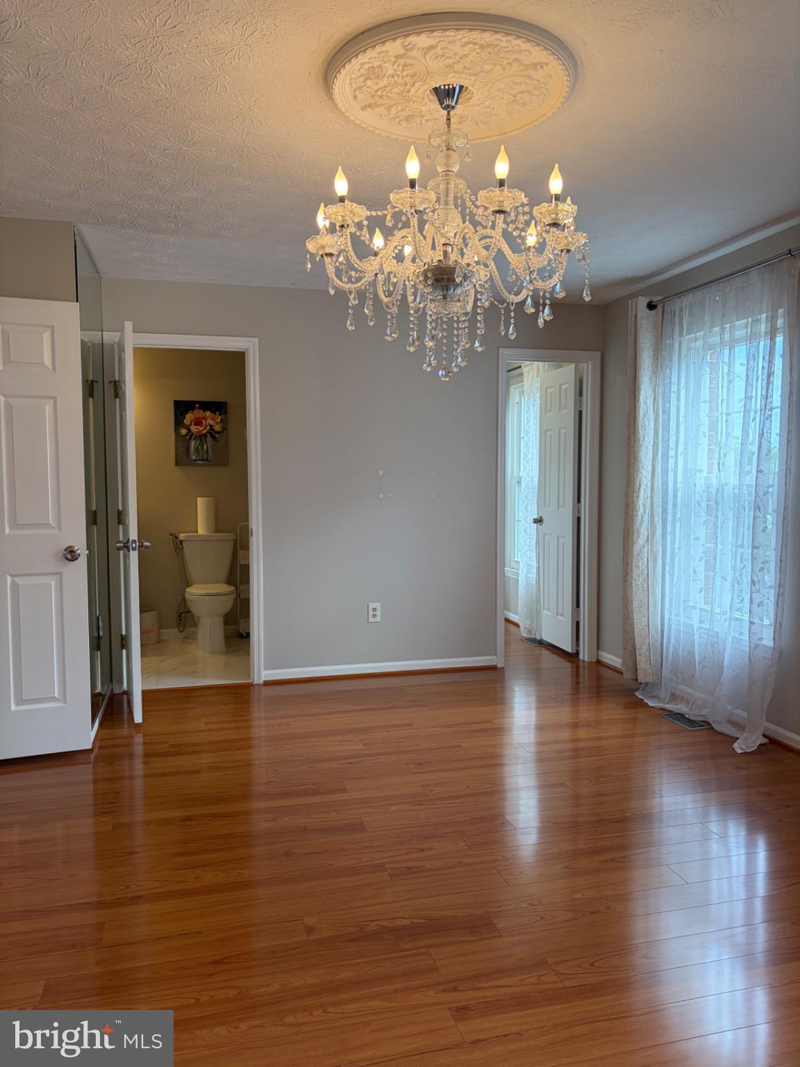 2117 Cross Trails Road Baltimore, MD 21244 - Photo 18 of 30 Elegant space with a sparkling chandelier.