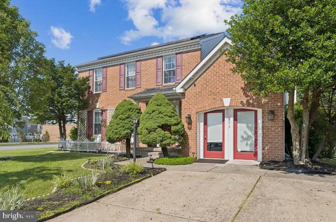 2117 Cross Trails Road Baltimore, MD 21244 - Photo 2 of 30 Charming brick home with lush greenery.