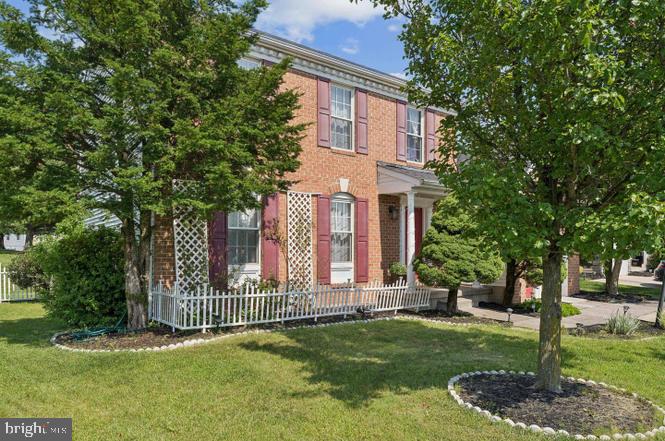 2117 Cross Trails Road Baltimore, MD 21244 - Photo 3 of 30 Charming brick home with lush greenery.