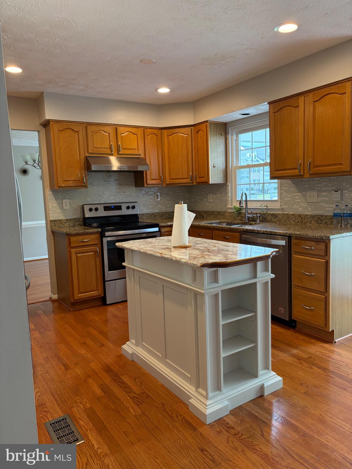 2117 Cross Trails Road Baltimore, MD 21244 - Photo 10 of 30 Modern kitchen with warm wood tones.