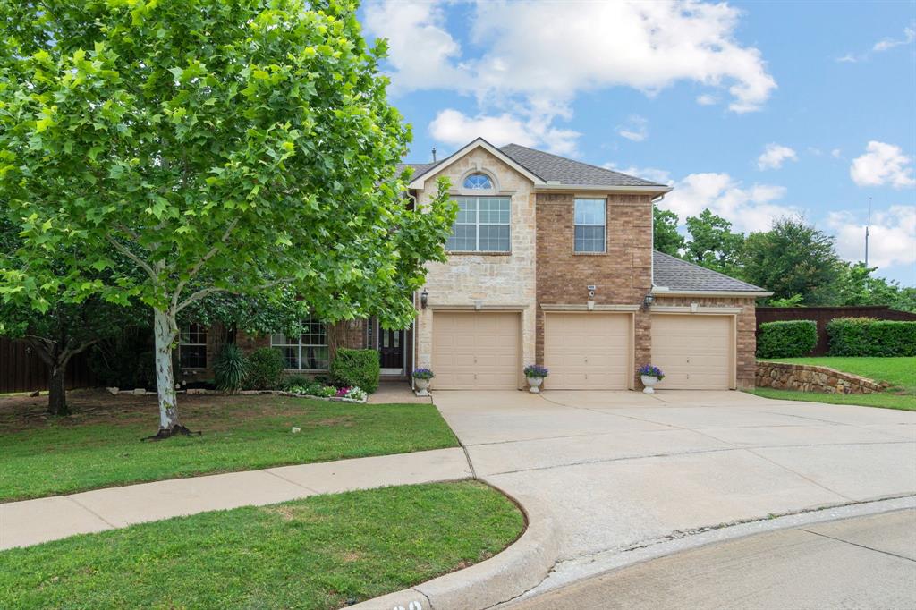2703 Pottery Trail Corinth, TX 76210 - Photo 2 of 40 a front view of a house with a yard and trees