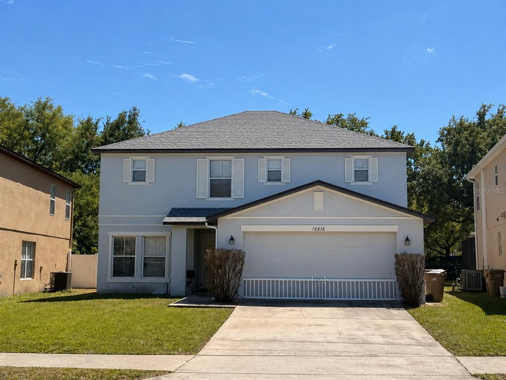 16816 Rising Star Drive Clermont, FL 34714 - Photo 1 of 21 a front view of a house with a yard