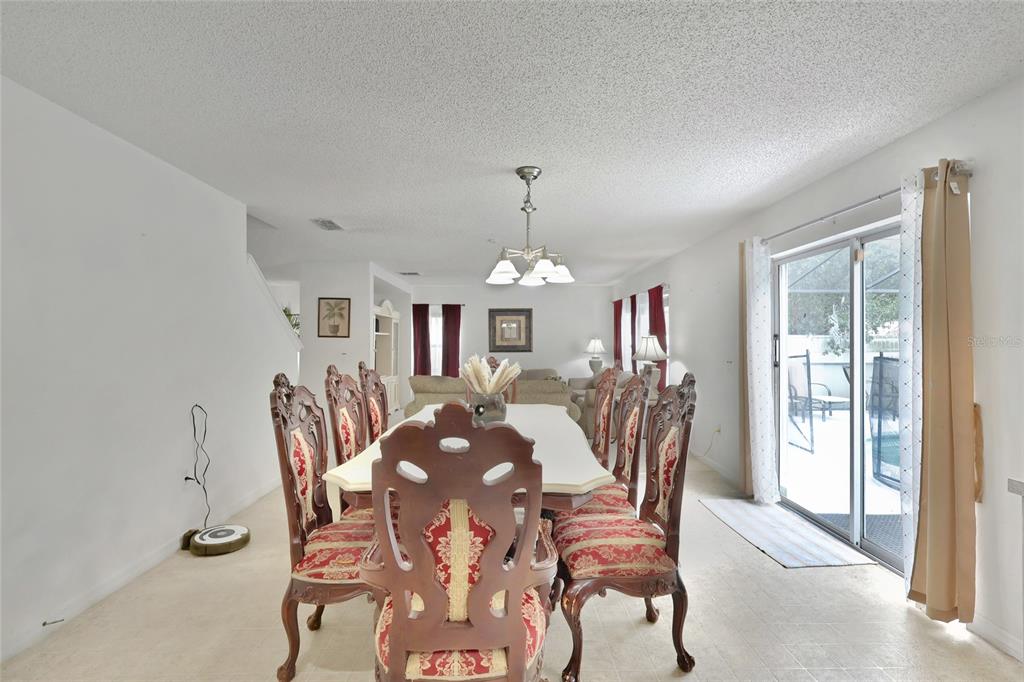 16816 Rising Star Drive Clermont, FL 34714 - Photo 13 of 21 a view of a dining room with furniture and chandelier