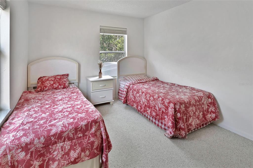 16816 Rising Star Drive Clermont, FL 34714 - Photo 17 of 21 a bedroom with a bed and window