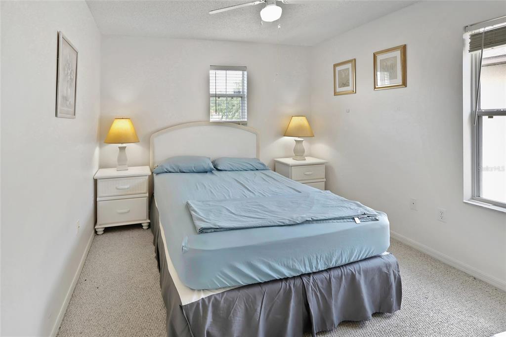 16816 Rising Star Drive Clermont, FL 34714 - Photo 18 of 21 a bedroom with a bed and window