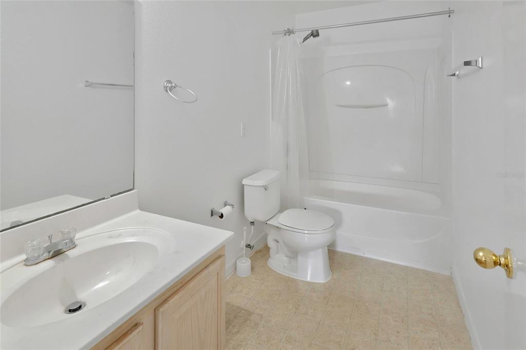 16816 Rising Star Drive Clermont, FL 34714 - Photo 19 of 21 a bathroom with a sink toilet and shower