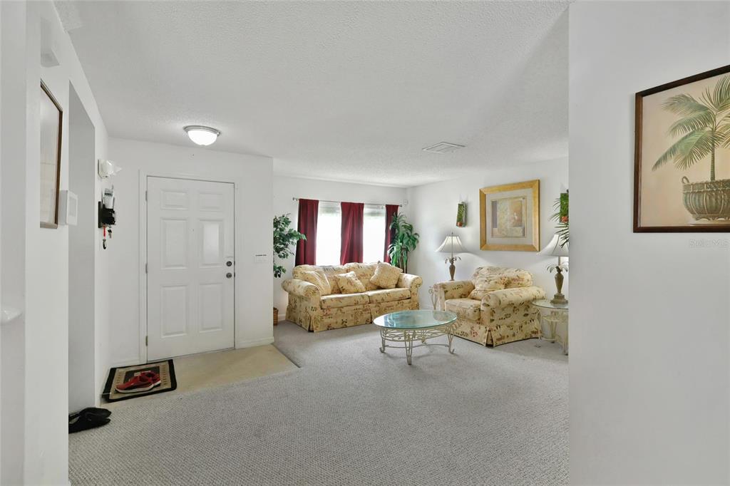 16816 Rising Star Drive Clermont, FL 34714 - Photo 5 of 21 a bed room with furniture and a ceiling fan