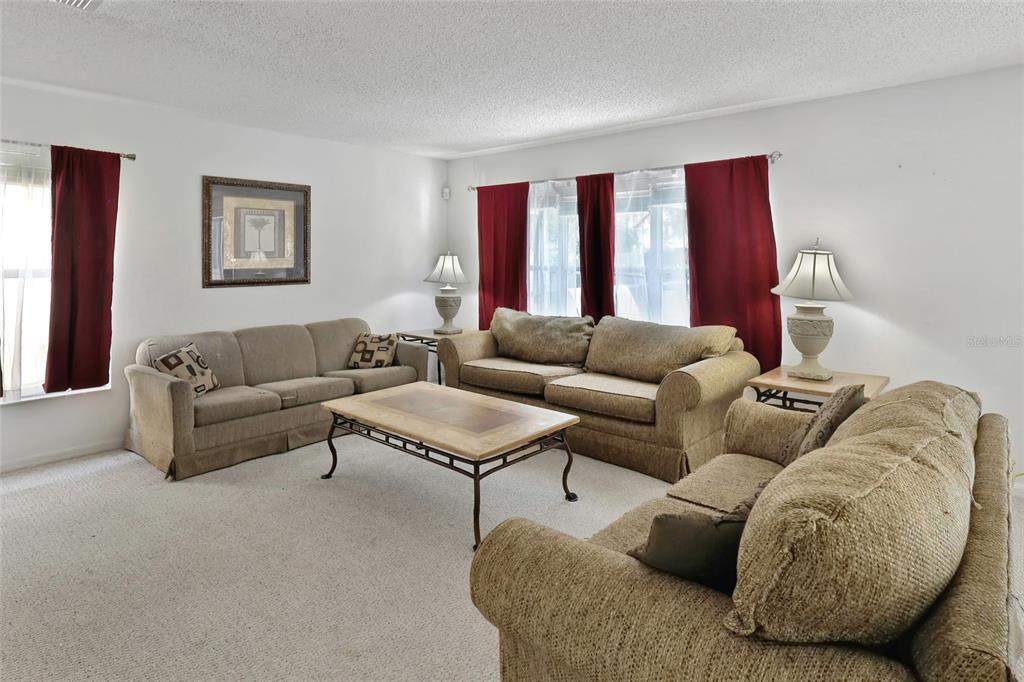 16816 Rising Star Drive Clermont, FL 34714 - Photo 6 of 21 a living room with furniture and a large window