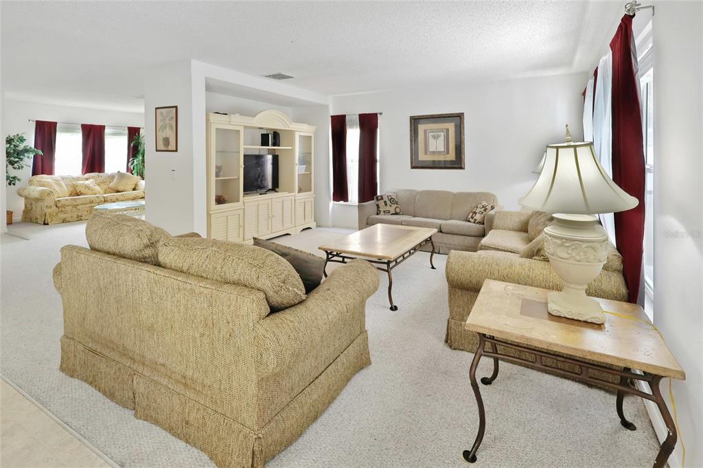 16816 Rising Star Drive Clermont, FL 34714 - Photo 7 of 21 a living room with furniture and a table