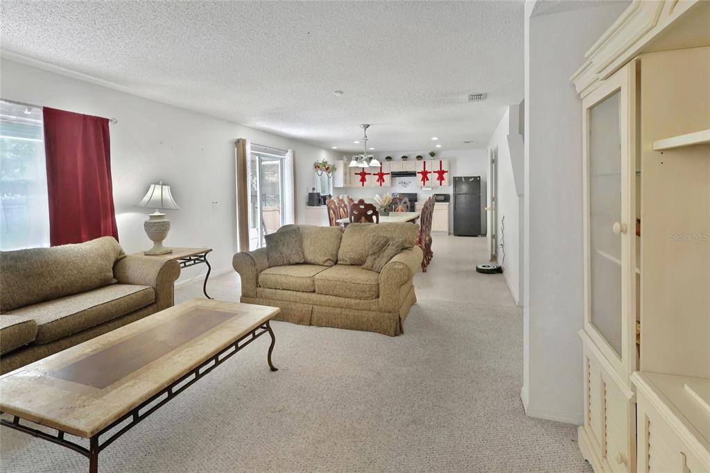 16816 Rising Star Drive Clermont, FL 34714 - Photo 8 of 21 a living room with furniture and a flat screen tv