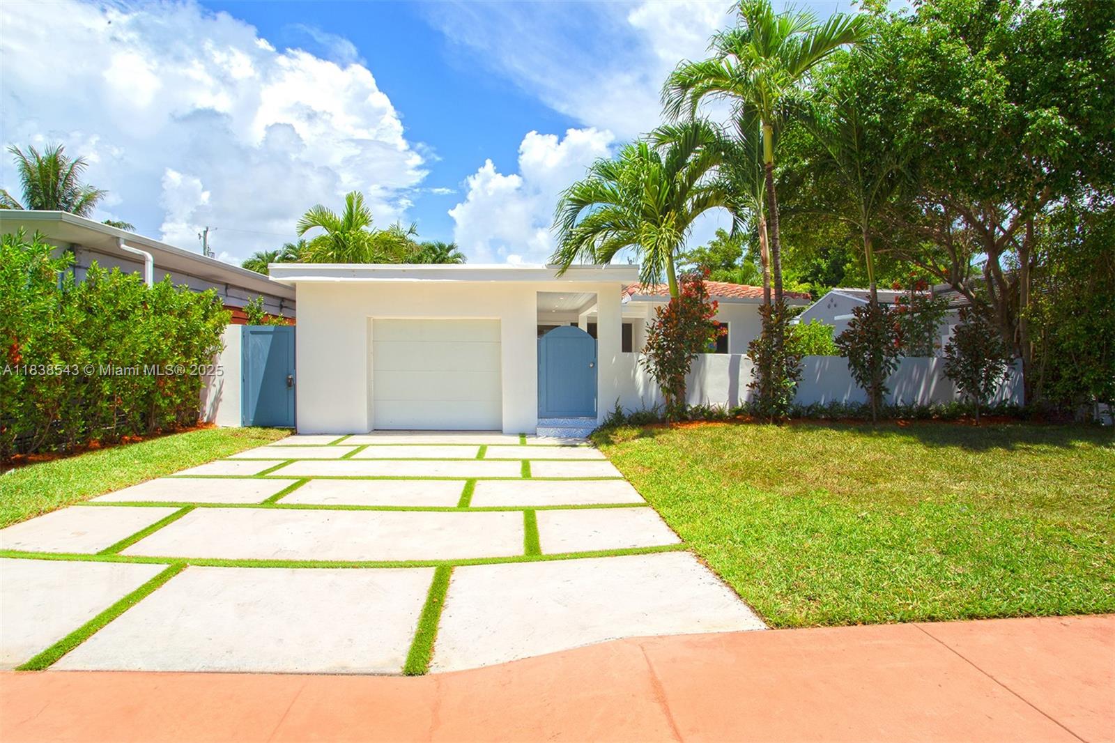 a house view with a backyard space