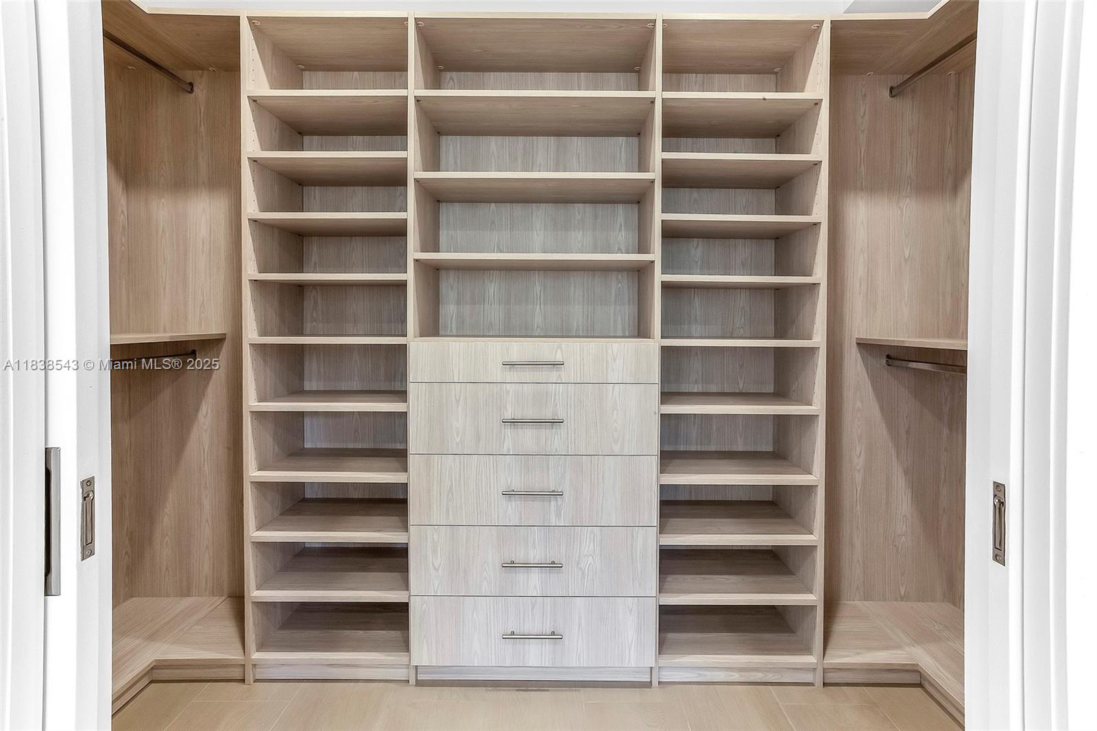 Normandy Isle Miami Beach, FL 33141 - Photo 28 of 43 a view of walk in closet with empty racks