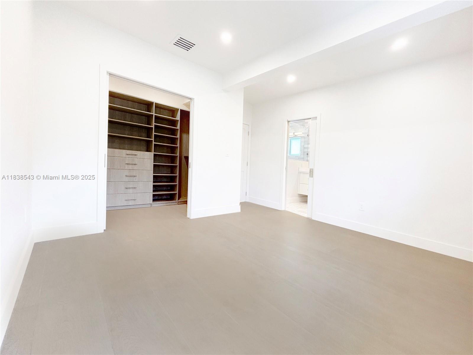 Normandy Isle Miami Beach, FL 33141 - Photo 29 of 43 a view of an empty room with a ceiling fan