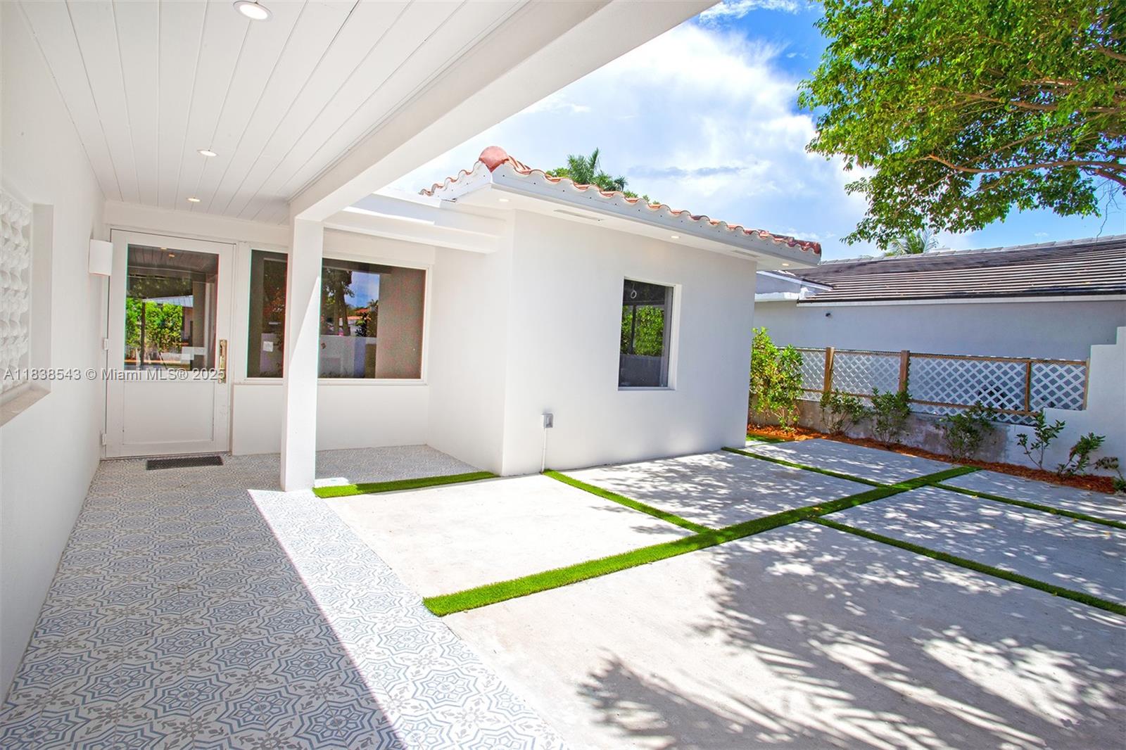 Normandy Isle Miami Beach, FL 33141 - Photo 3 of 43 a front view of a house with garden