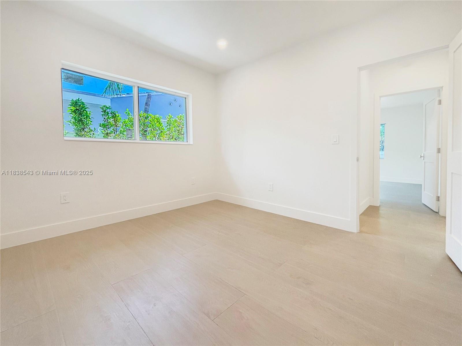 Normandy Isle Miami Beach, FL 33141 - Photo 31 of 43 an empty room with a window