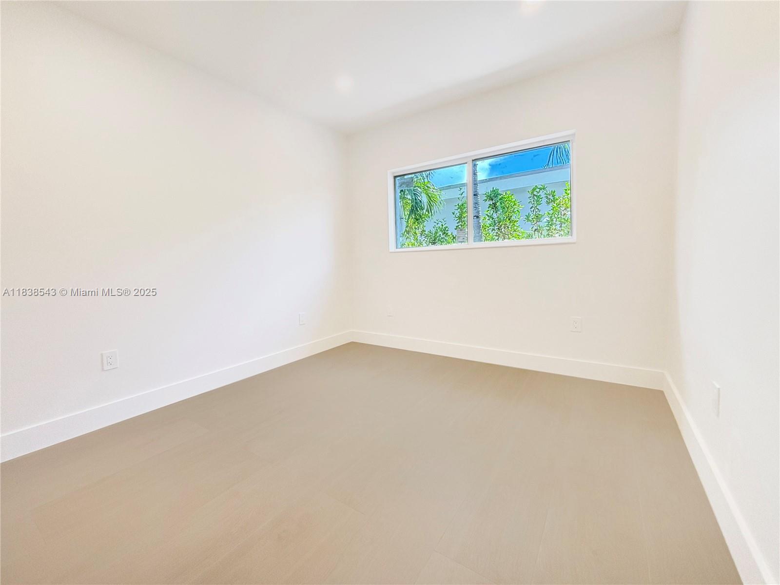 Normandy Isle Miami Beach, FL 33141 - Photo 32 of 43 an empty room with a window