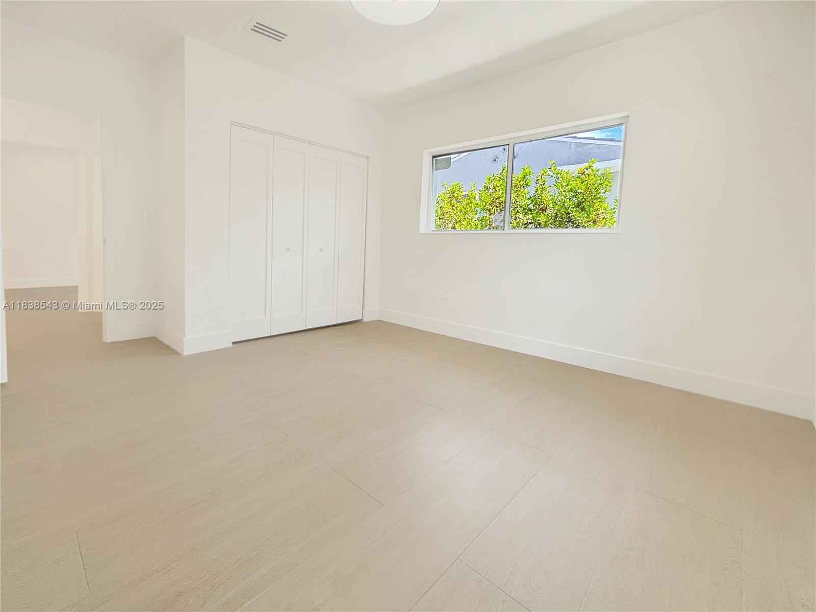 Normandy Isle Miami Beach, FL 33141 - Photo 34 of 43 an empty room with a window