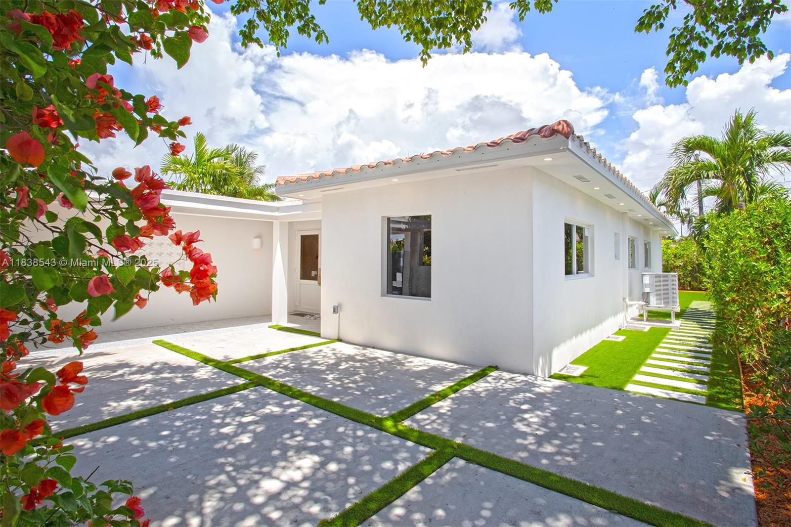 Normandy Isle Miami Beach, FL 33141 - Photo 5 of 43 a view of a backyard with potted plants