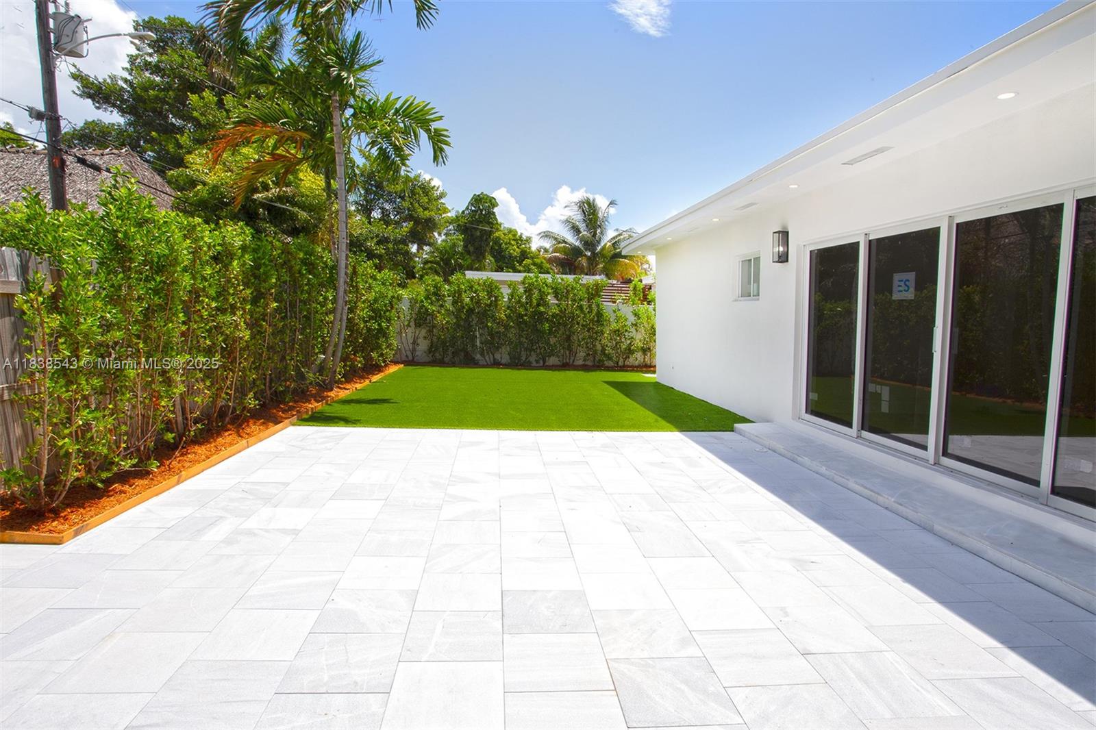 Normandy Isle Miami Beach, FL 33141 - Photo 9 of 43 a view of backyard with seating space