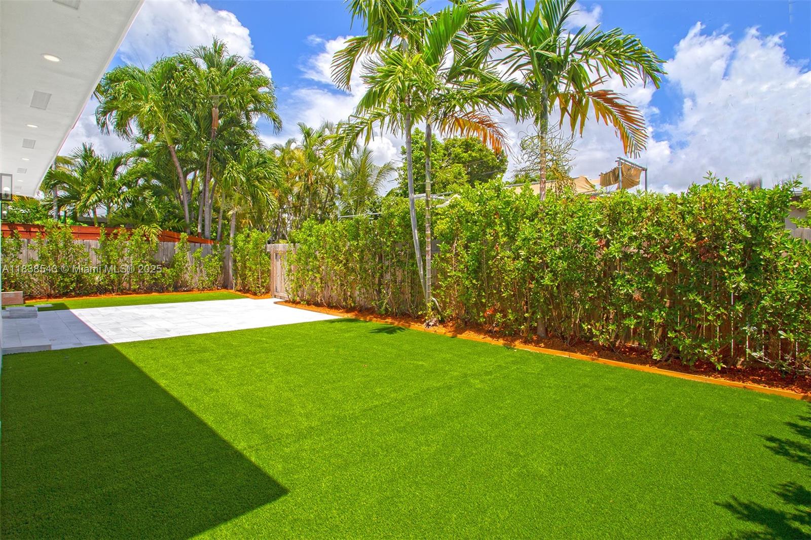 Normandy Isle Miami Beach, FL 33141 - Photo 10 of 43 a view of a backyard with a garden