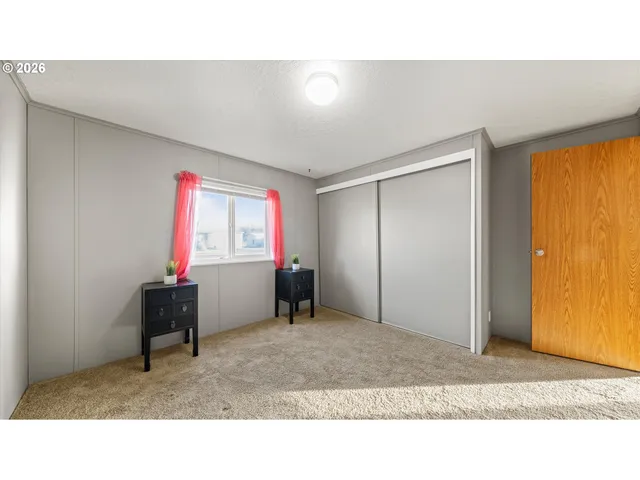 a kitchen with a refrigerator and television