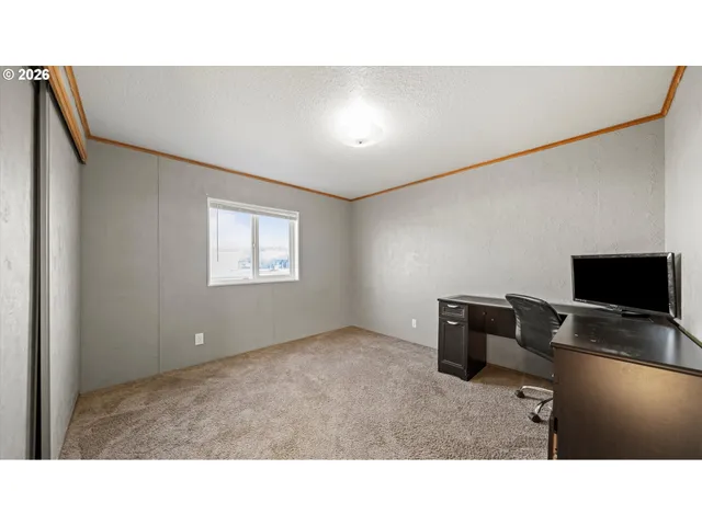 a kitchen with a refrigerator and cabinets