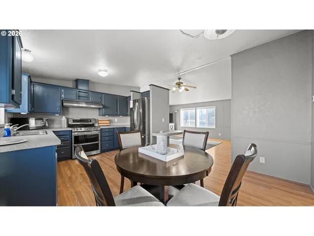 a kitchen with a table and chairs in it