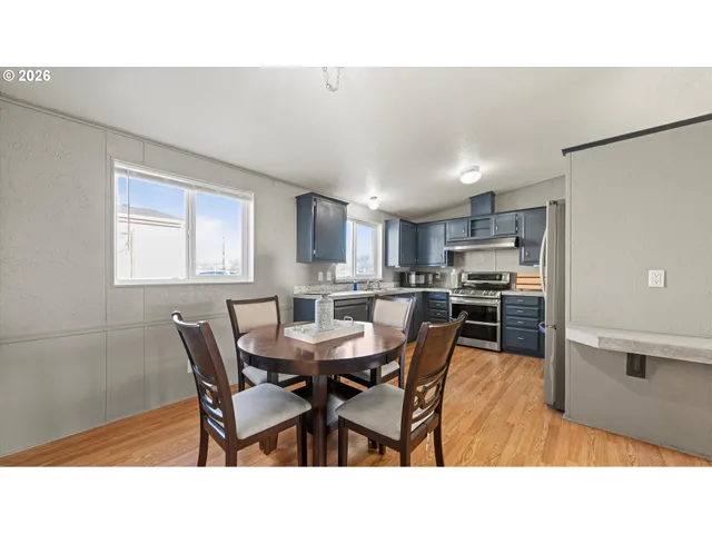 a open kitchen with dining table and chairs