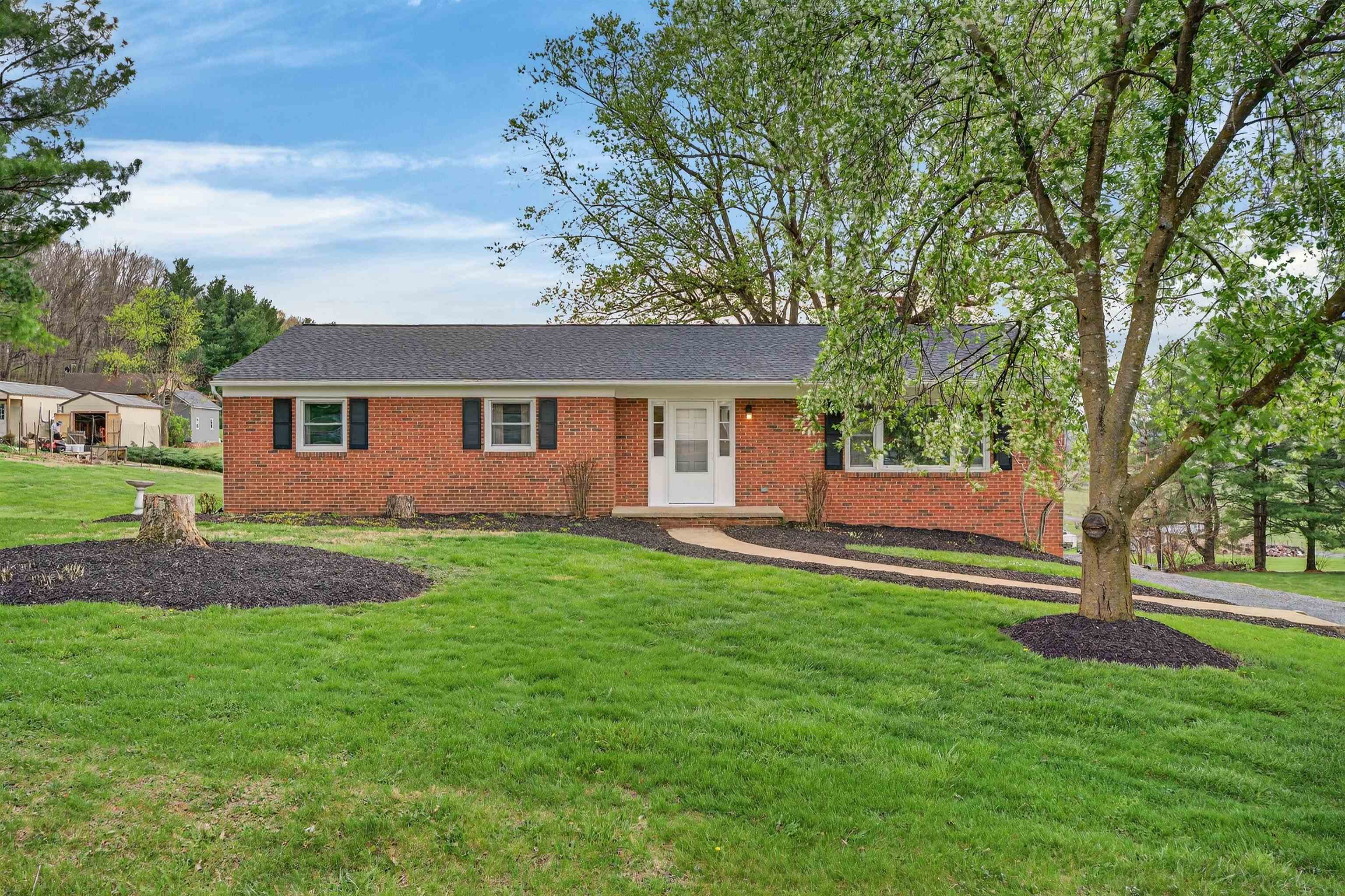 3259 Zion Church Road Broadway, VA 22815 - Photo 1 of 48 a front view of a house with a garden