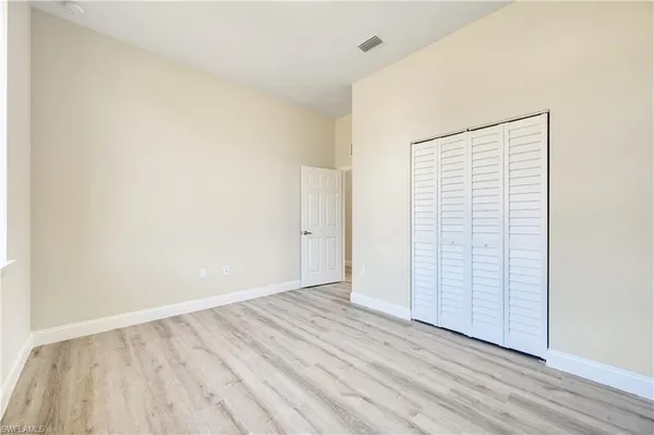 wooden floor in a hall with an empty room