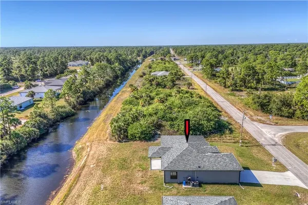 a view of a large body of water with a building in the background