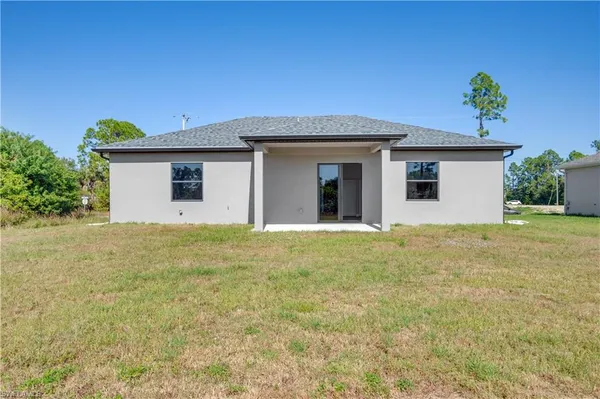 a view of a big yard with potted plants