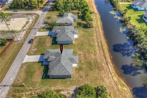 swimming pool view with a garden